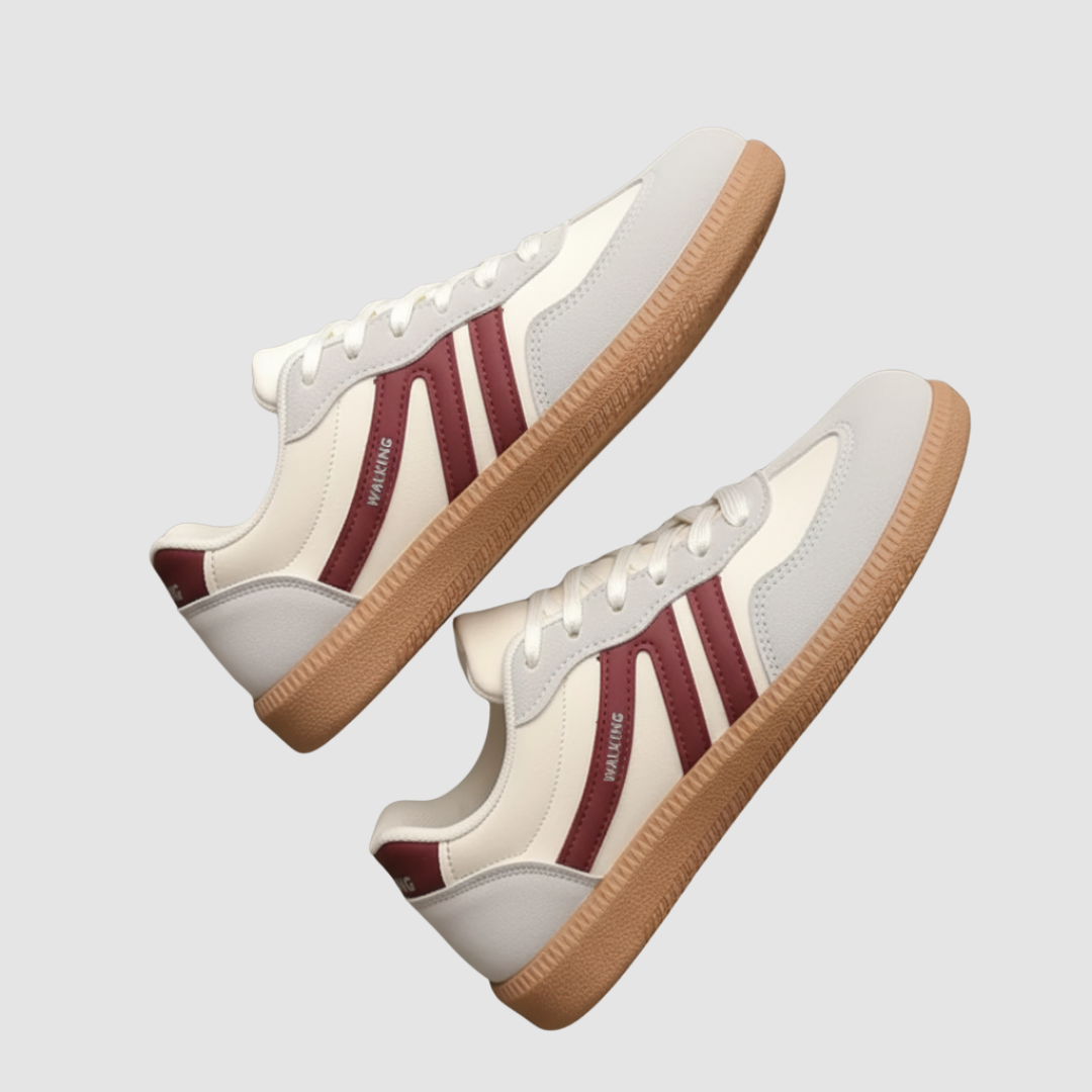 White women's lace-up sneakers with bold side stripes, cushioned rubber sole for everyday comfort