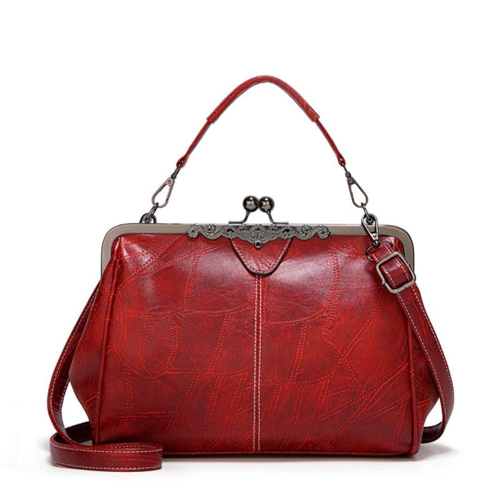 Jacqueline structured faux leather handbag in neutral tone with vintage clasp closure and adjustable strap