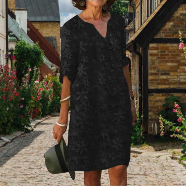 Women's casual floral midi dress with flattering V-neckline, relaxed short sleeves, effortless daywear style