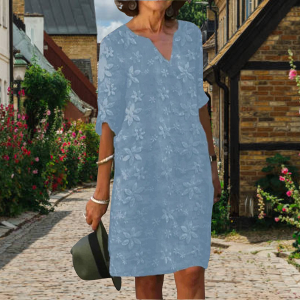 Women's casual floral midi dress with flattering V-neckline, relaxed short sleeves, effortless daywear style