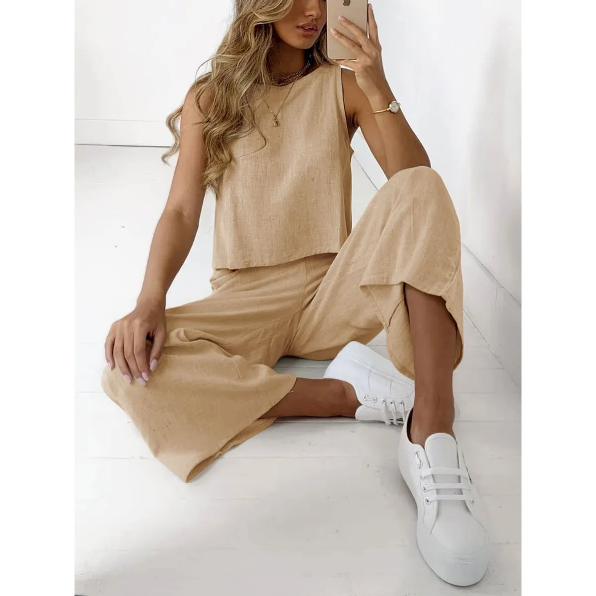 Women's beige linen two-piece set with relaxed-fit pants and matching top, breathable everyday outfit