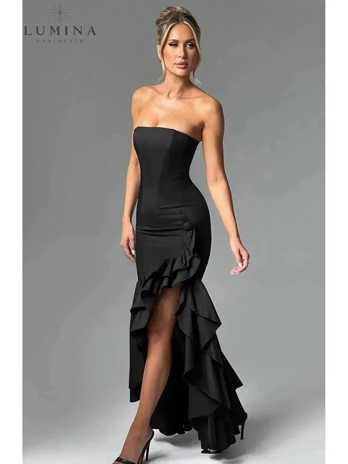 Elegant sleeveless ruffle maxi dress with flowing silhouette and daring side slit for women