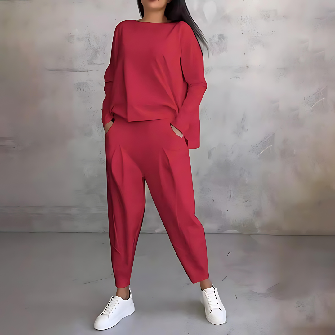 Women's loose fit two-piece set featuring flowy long-sleeve top and tapered pants for chic travel style