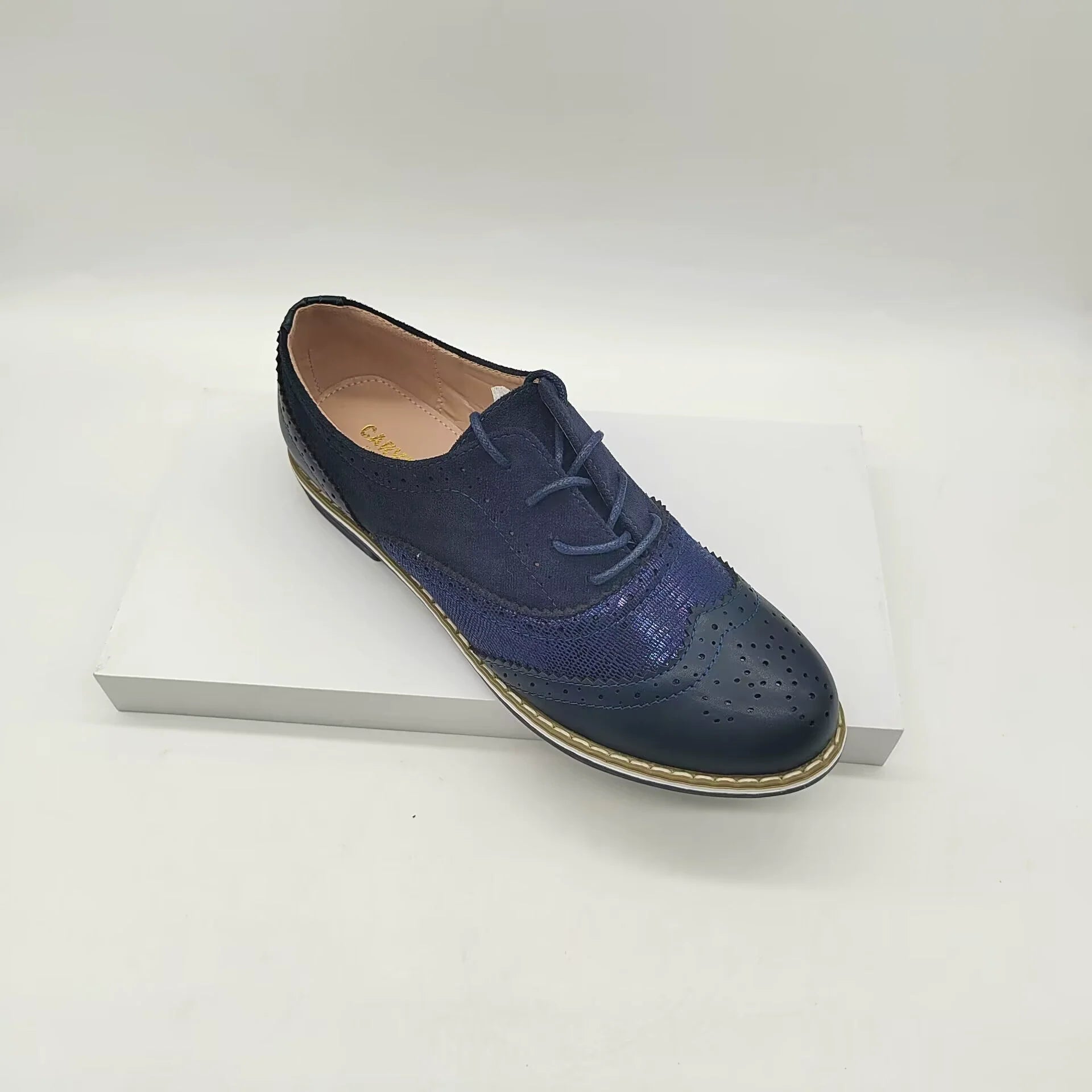 Women's brown faux leather brogue shoes with lace-up closure and classic perforated detailing