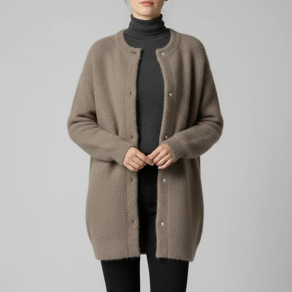 Women's oversized collarless cardigan with button-down front, relaxed minimalist layering style
