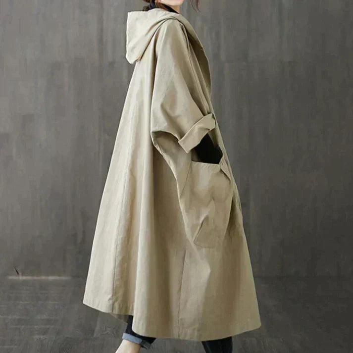 Women's oversized beige trench coat with waist belt, classic chic silhouette for everyday elegance