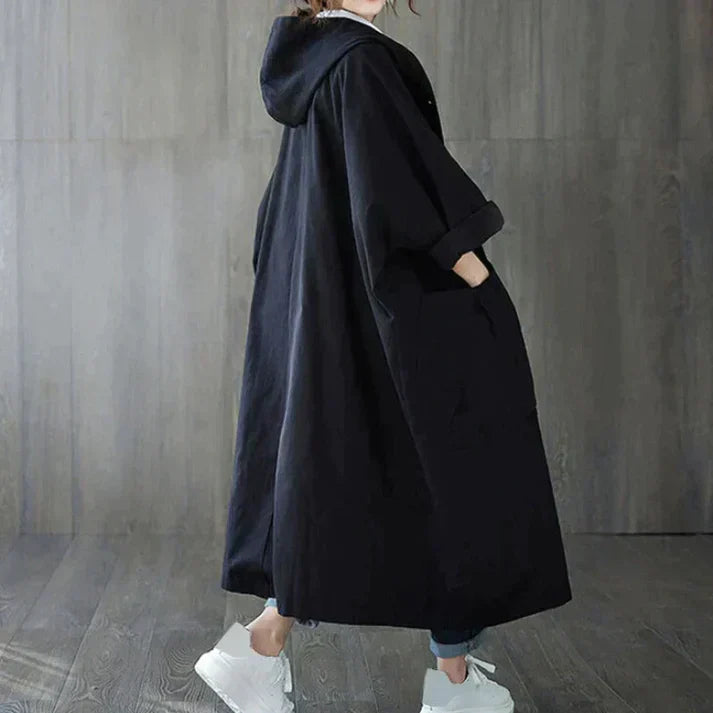 Women's oversized beige trench coat with waist belt, classic chic silhouette for effortless elegance