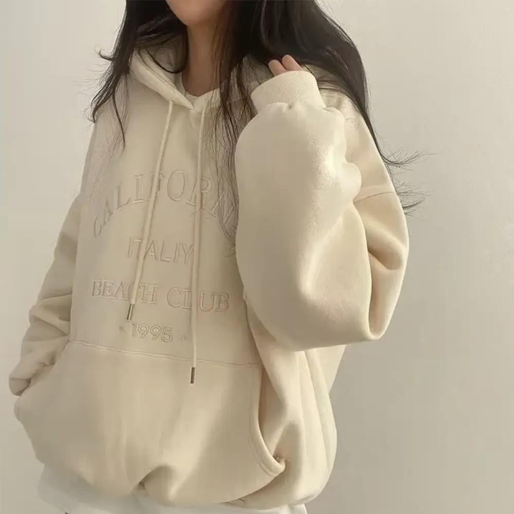 Women's fleece-lined hoodie loose fit cozy warm chic layering essential in neutral tone