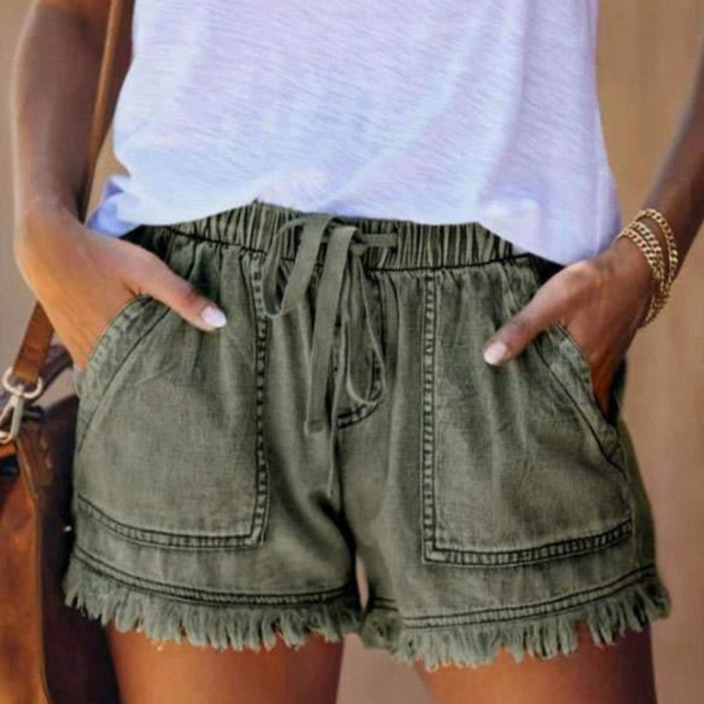 Women's high waisted blue denim shorts casual fit with drawstring waist and fringed hem