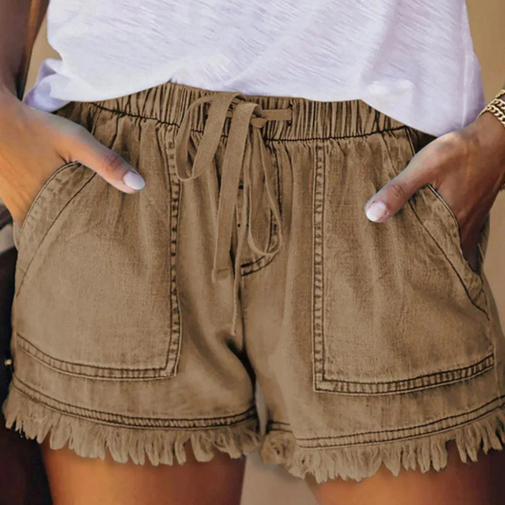 Women's high waisted blue denim shorts casual fit with drawstring waist and fringed hem