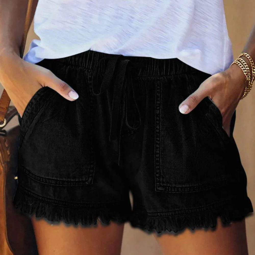 Women's high waisted blue denim shorts casual fit with drawstring waist and fringed hem