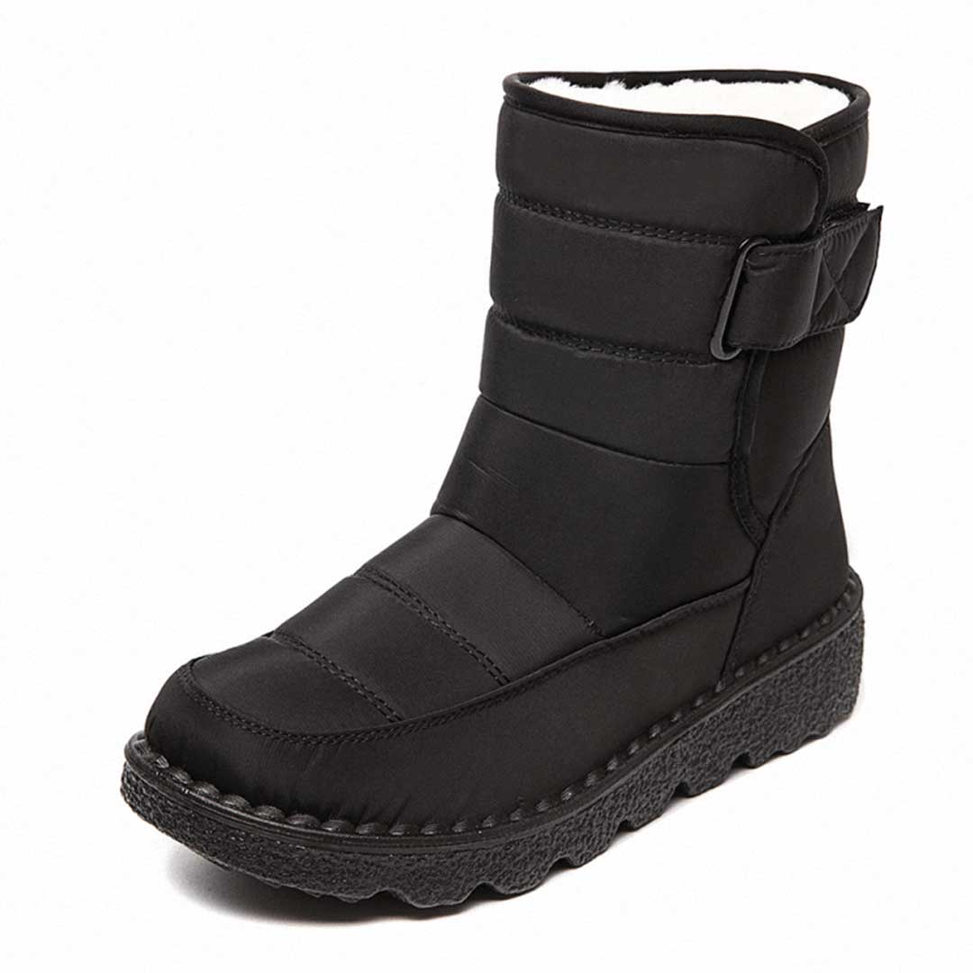 Women's mid-calf quilted winter boots with insulated lining and velcro strap closure for cozy warmth