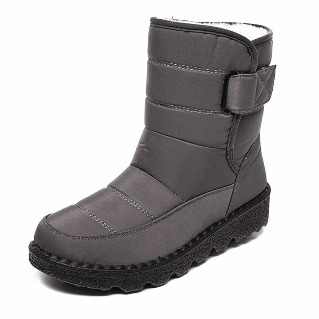 Women's black mid-calf quilted winter boots with insulated lining and velcro strap closure