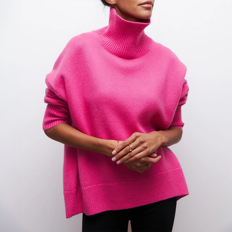 Women's oversized cream knit turtleneck sweater with draped silhouette and ribbed cuffs