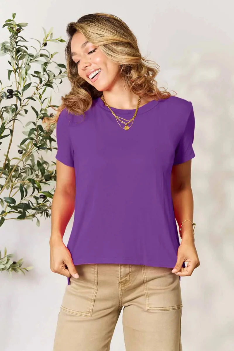 Women's short sleeve tunic top in rayon blend with slit hem, relaxed office-ready silhouette