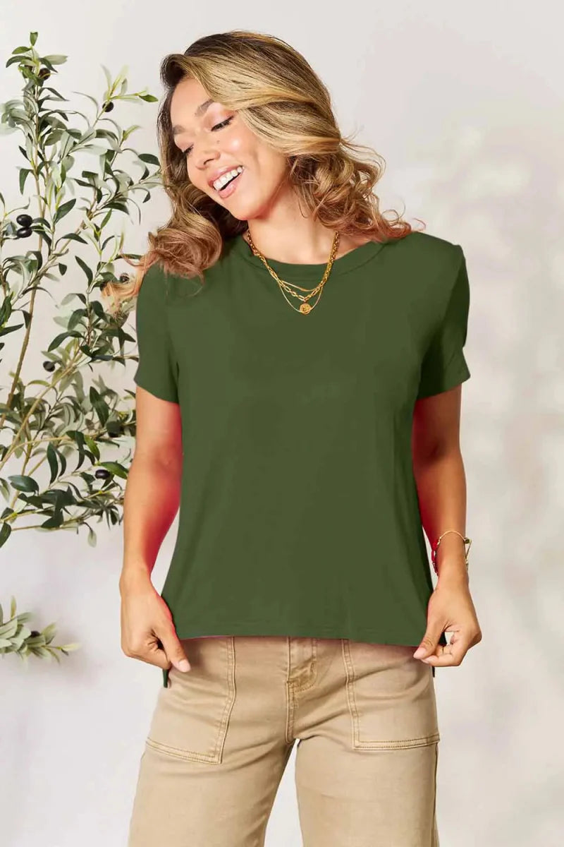 Women's short sleeve rayon tunic top with slit hem, relaxed office-ready silhouette in versatile solid color