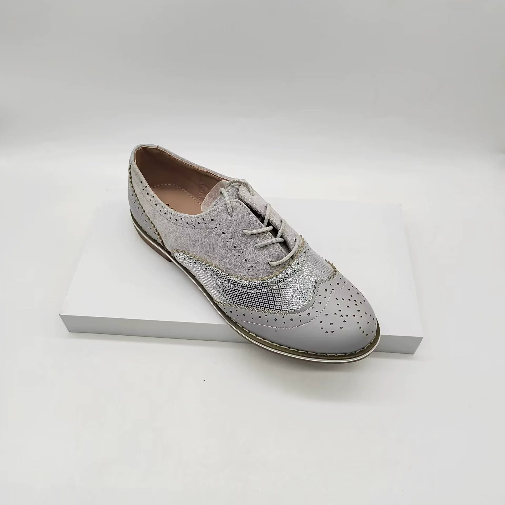 Women's brown faux leather lace-up brogue shoes with classic perforated detailing for everyday comfort