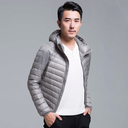 Men's lightweight packable down hoodie jacket, water-resistant shell, compact travel-ready layer