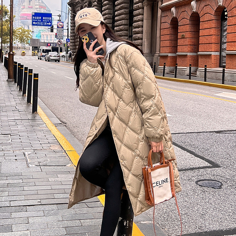 Loose-fit down jacket in neutral tones, ultra-warm insulation, relaxed silhouette for outdoor layering