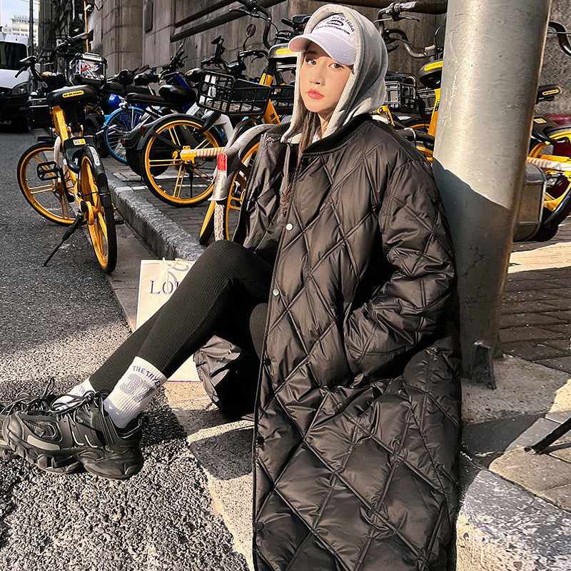 Loose-fit down jacket in neutral tones, relaxed silhouette with lightweight insulation for cold-weather layering
