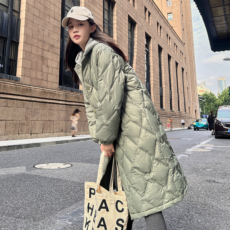 Loose-fit down jacket in neutral tones, relaxed silhouette with lightweight insulation for cold-weather layering