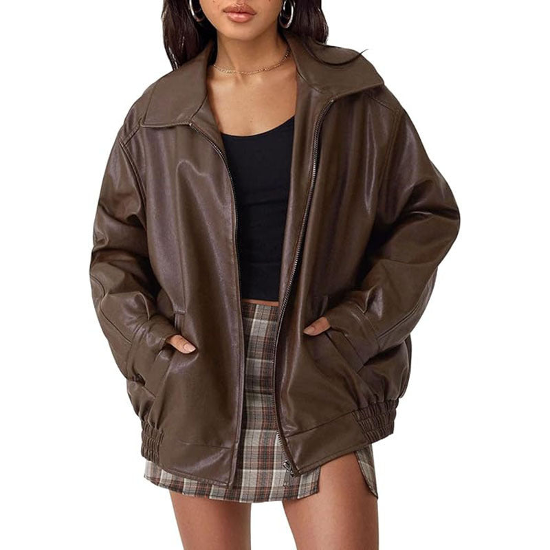 Women's black genuine leather biker jacket with moto-style zipper pockets and structured fit