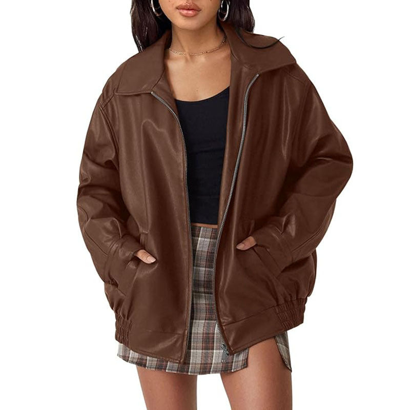 Women's black genuine leather biker jacket with moto-style zipper pockets and durable tailored fit