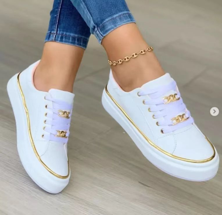 Women's white leather low-top lace-up sneakers with polished premium finish and sleek casual silhouette