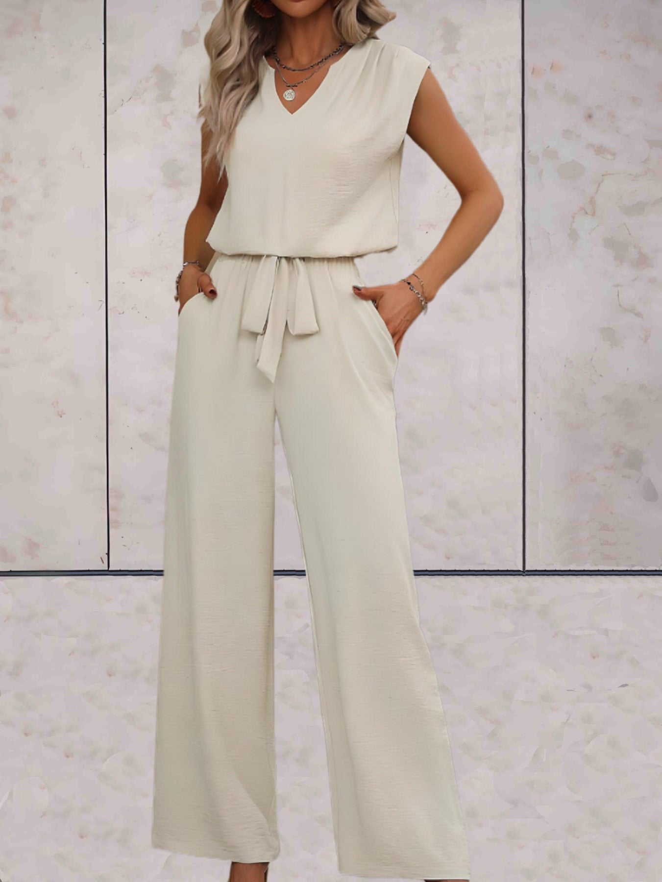 Elegant sleeveless blouse set with lace V-neckline and high-waisted straight-leg pants for women