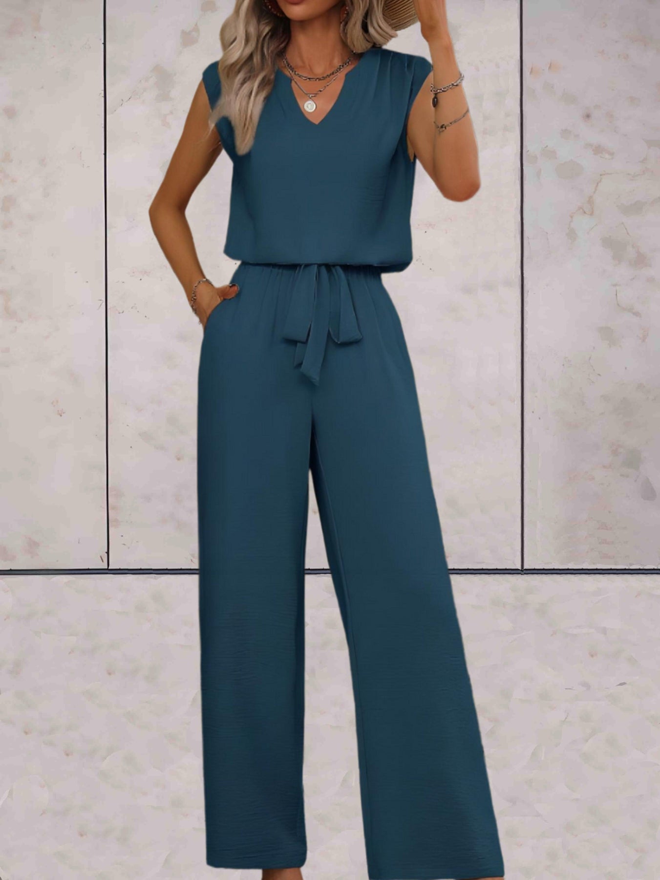 Women's sleeveless blouse set with lace V-neckline and high-waisted straight-leg pants