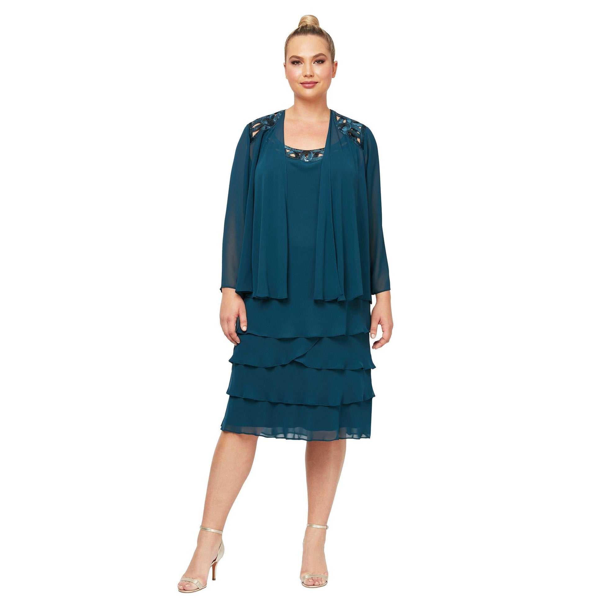 Navy blue knee-length mother of bride dress with sequined neckline and matching jacket