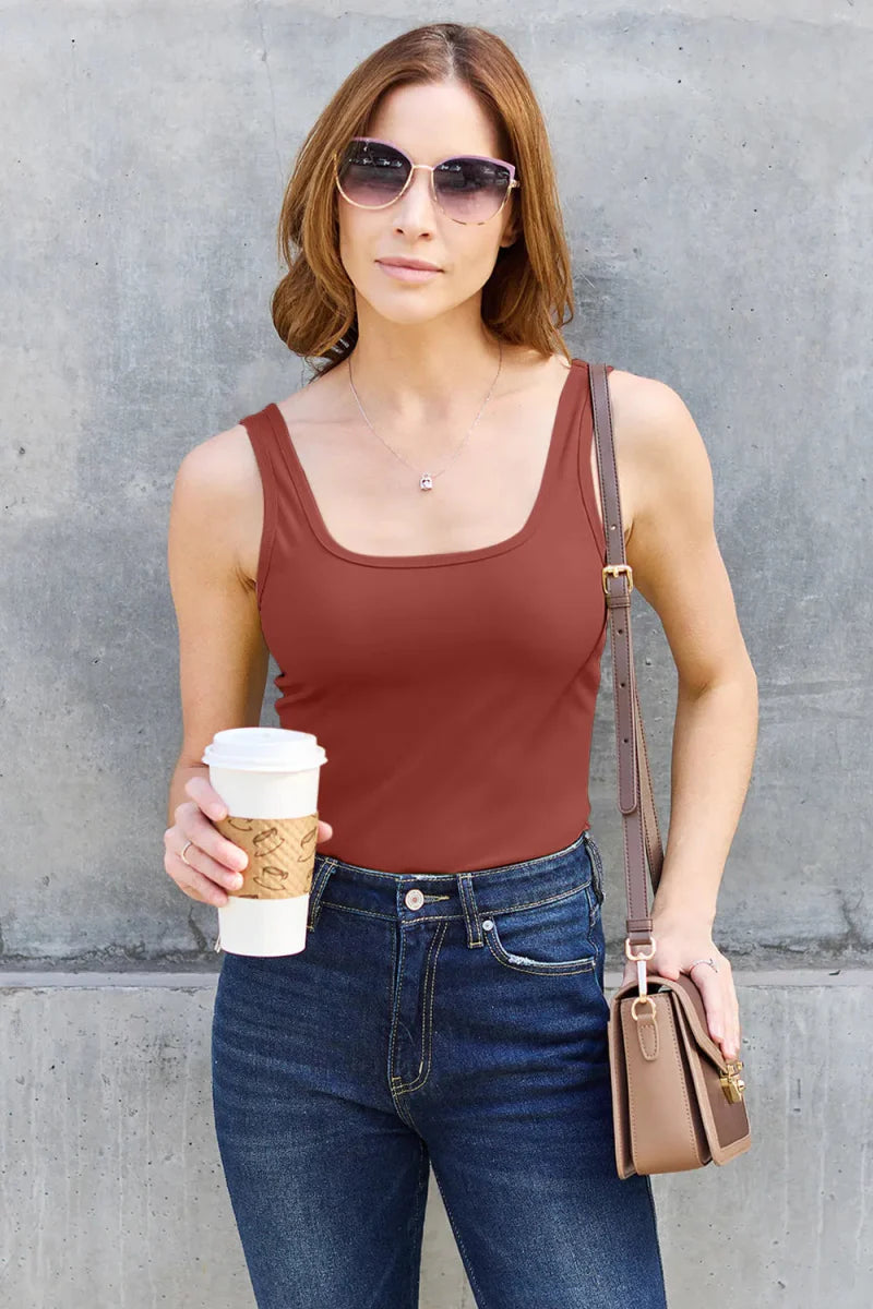 Women's sleeveless fitted camisole tank top in neutral tone, stretchy nylon-spandex office layering piece