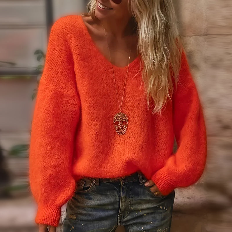 Soft fluffy oversized v-neck women's knit sweater in cozy autumn style with loose silhouette