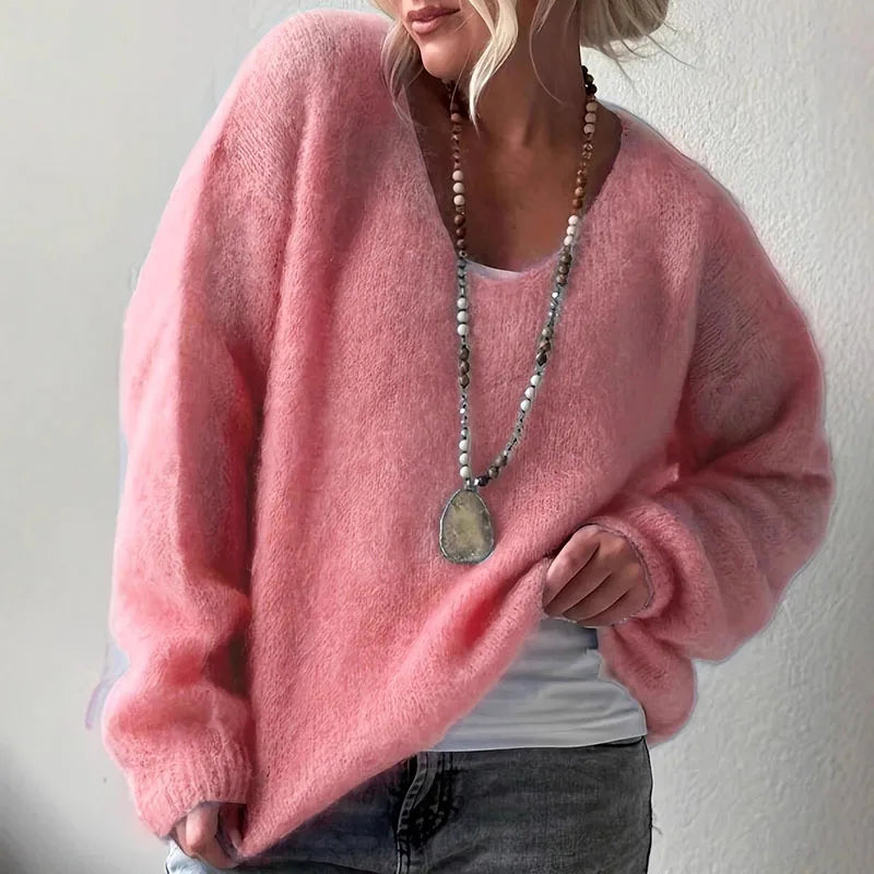 Soft fluffy oversized V-neck women's knit sweater in cozy autumn style with loose silhouette