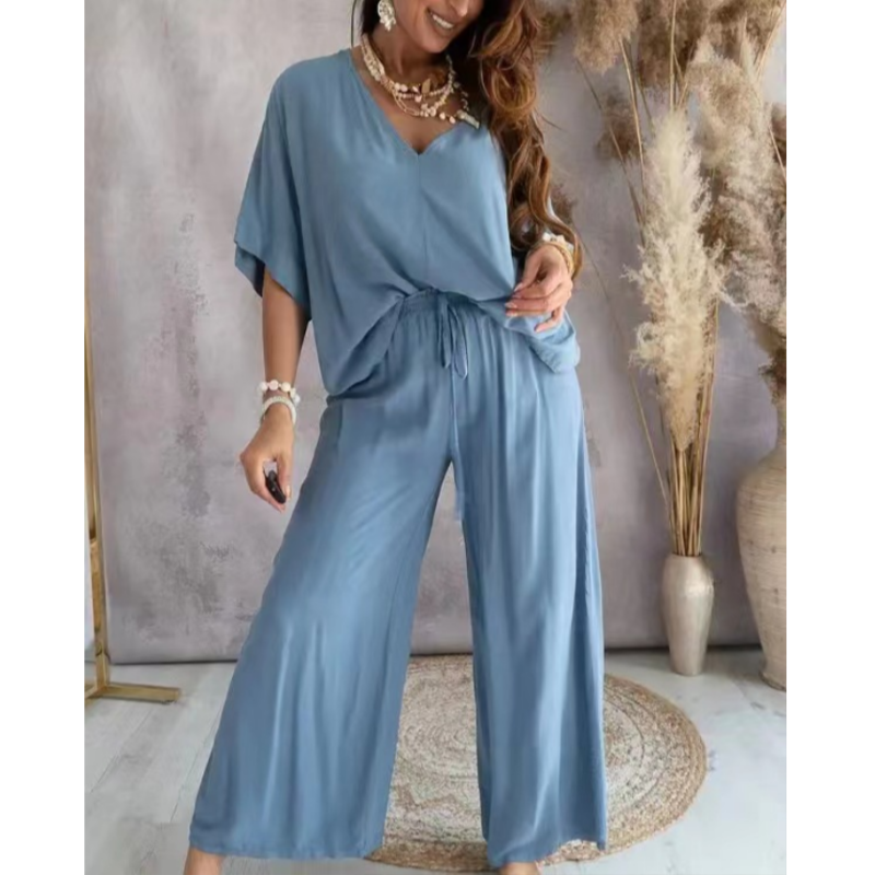 Women's loungewear set featuring oversized V-neck top and wide-leg pants in soft breathable cotton blend