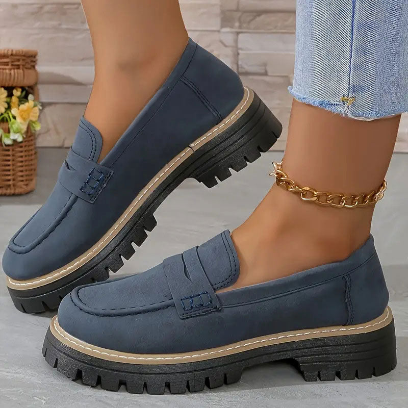 Women's chunky sole loafers with round toe, classic vamp strap, and modern comfort fit design