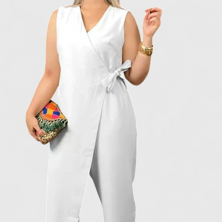 Women's wide-leg wrap jumpsuit with flowing silhouette, structured top, and chic overlapping bodice