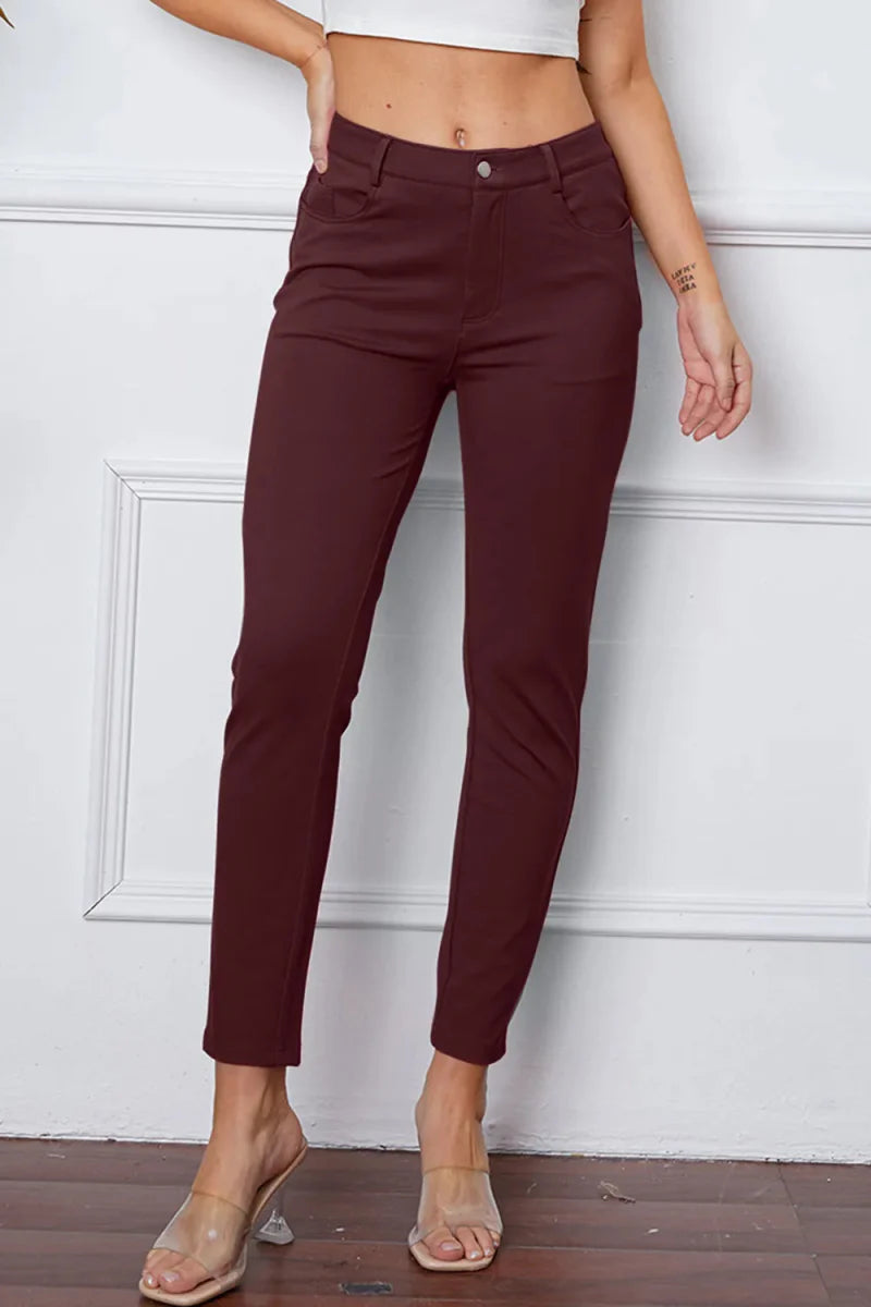 Women's high-rise knit flare pants in neutral stretch fabric with flattering silhouette and pockets