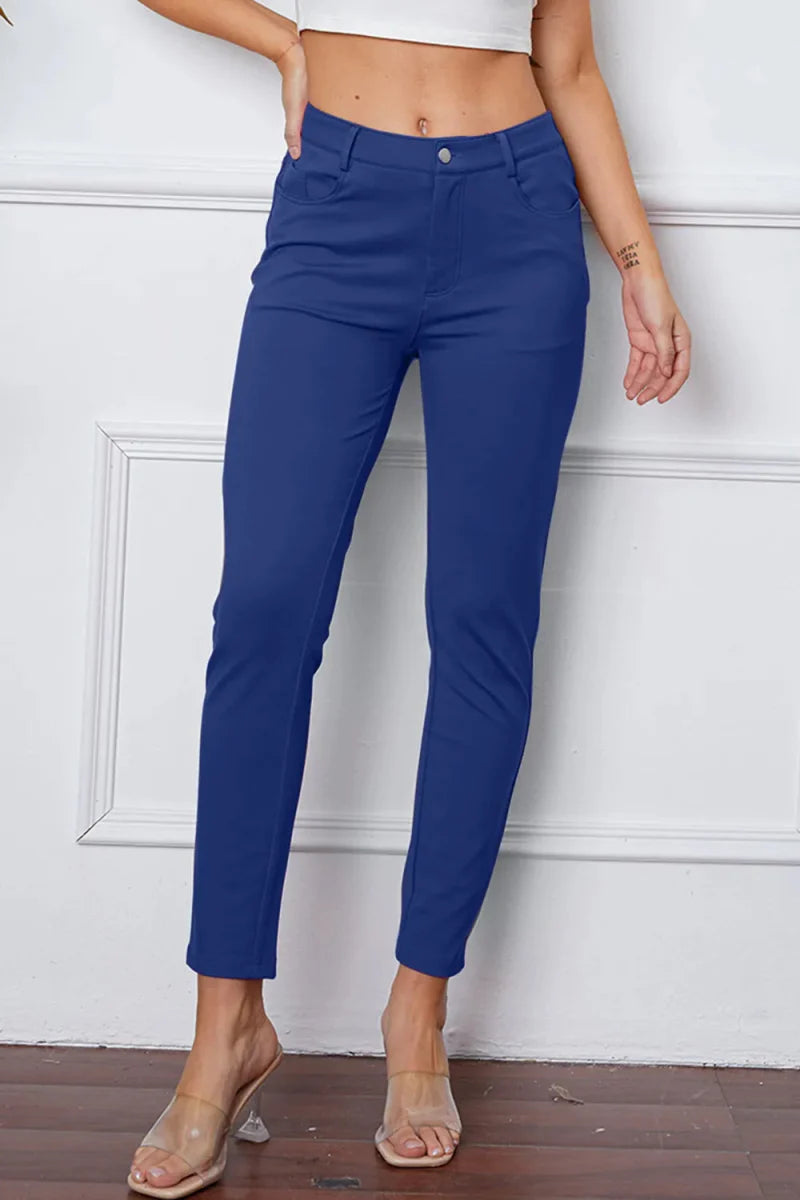 Women's high-rise knit flare pants in neutral stretch fabric with flattering silhouette and practical pockets