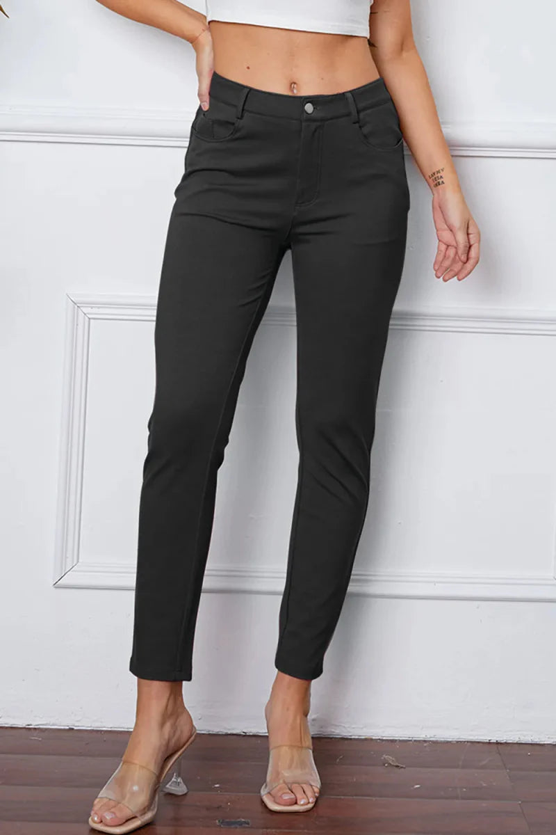 Women's high-rise knit flare pants in neutral stretch fabric with flattering silhouette and pockets