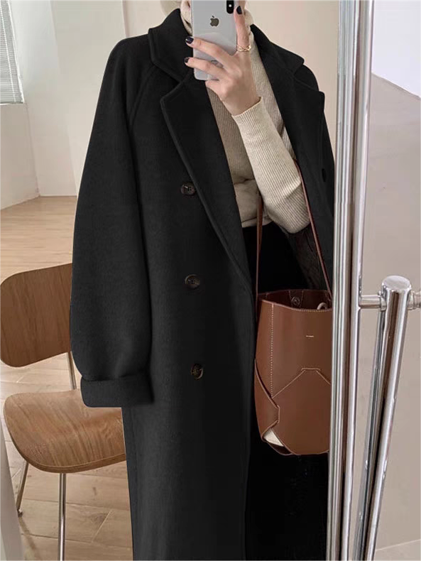 Women's oversized belted wool coat with notched lapels in classic winter style for effortless layering