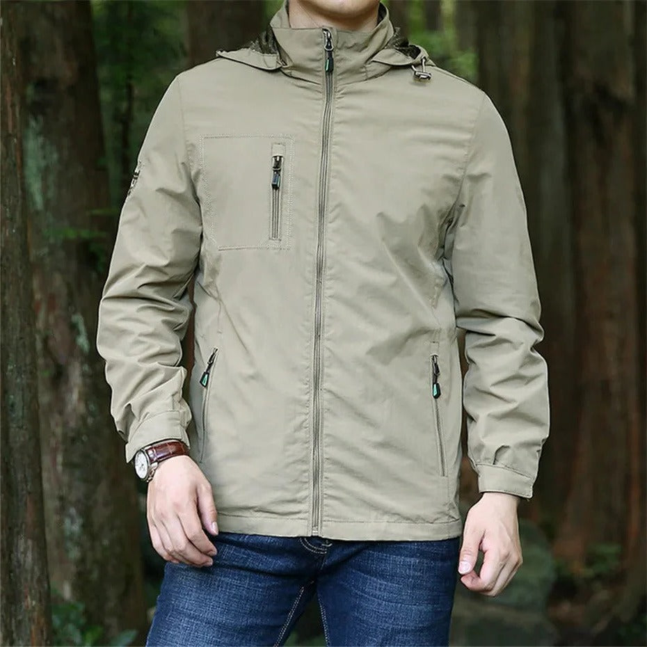 Lightweight weatherproof adventure jacket in neutral tone, relaxed outdoor fit with rain-ready protection
