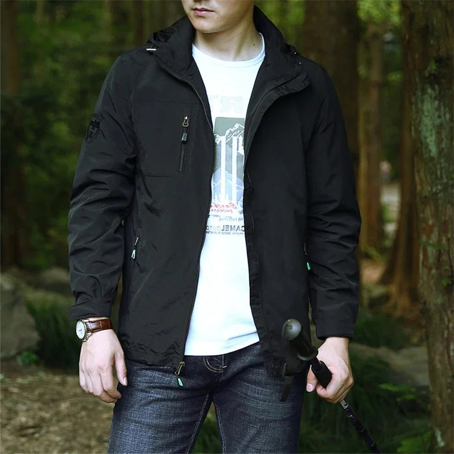 Lightweight weatherproof olive green adventure jacket with packable hood for outdoor trail enthusiasts