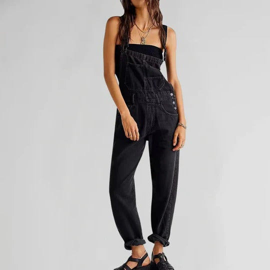 Women's sleeveless denim jumpsuit in classic blue, slim modern cut with clean minimalist lines