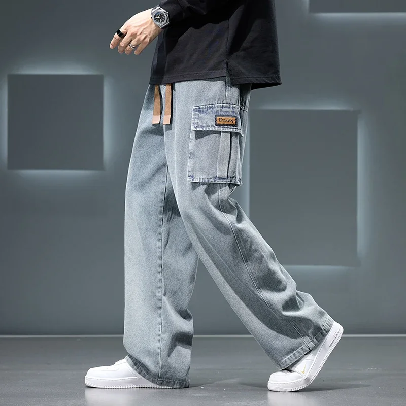 Blue cargo denim pants oversized utility pockets adjustable drawstring waist urban streetwear style
