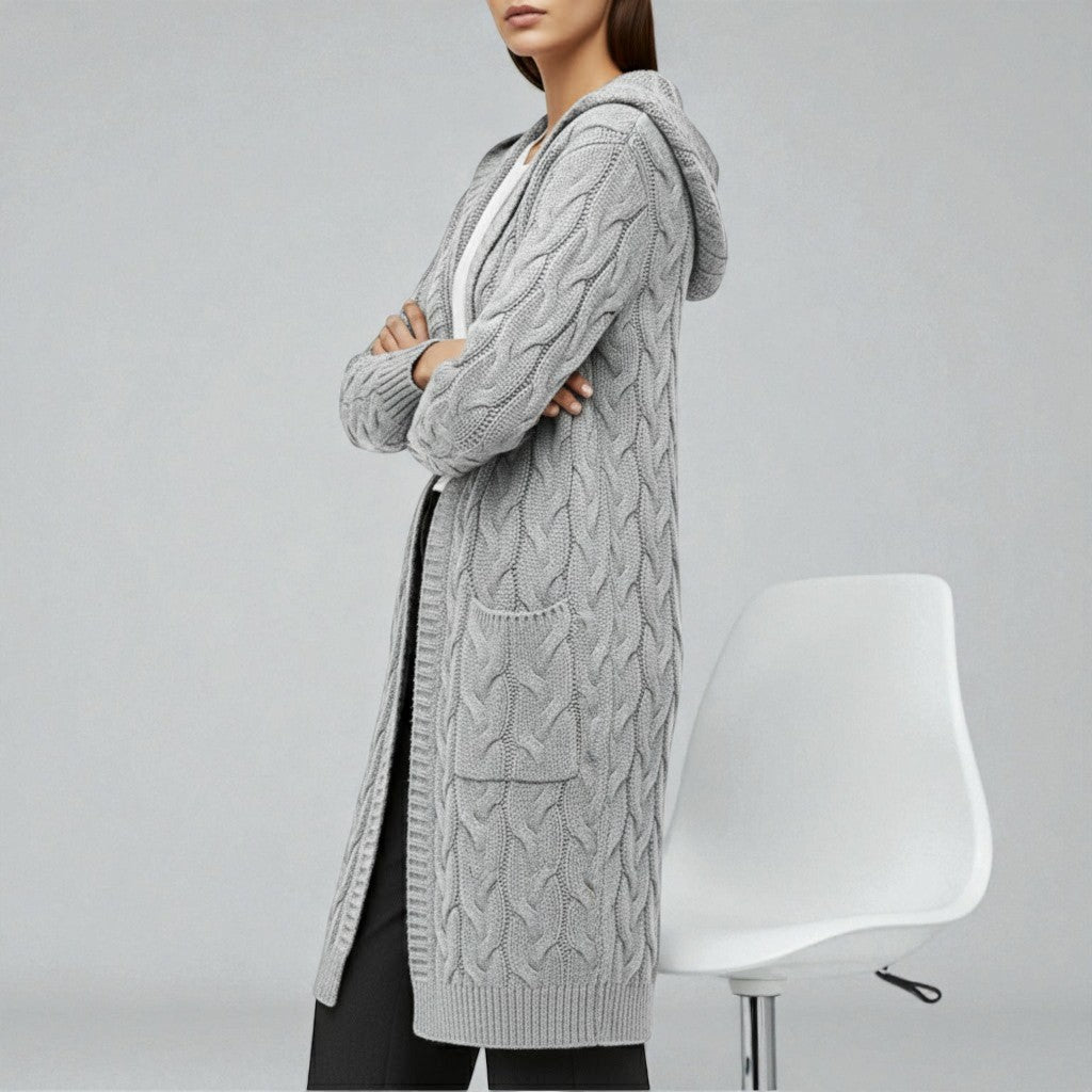 Women's cable knit long open-front cardigan in neutral tones with timeless texture for winter layering