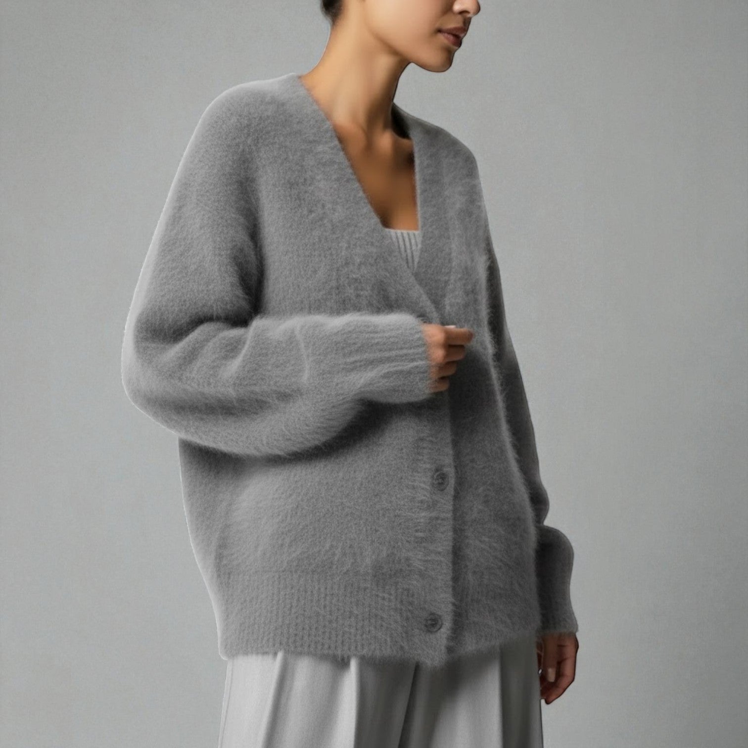 Women's loose-fit V-neck knit sweater in soft fabric, feminine silhouette for cozy winter warmth