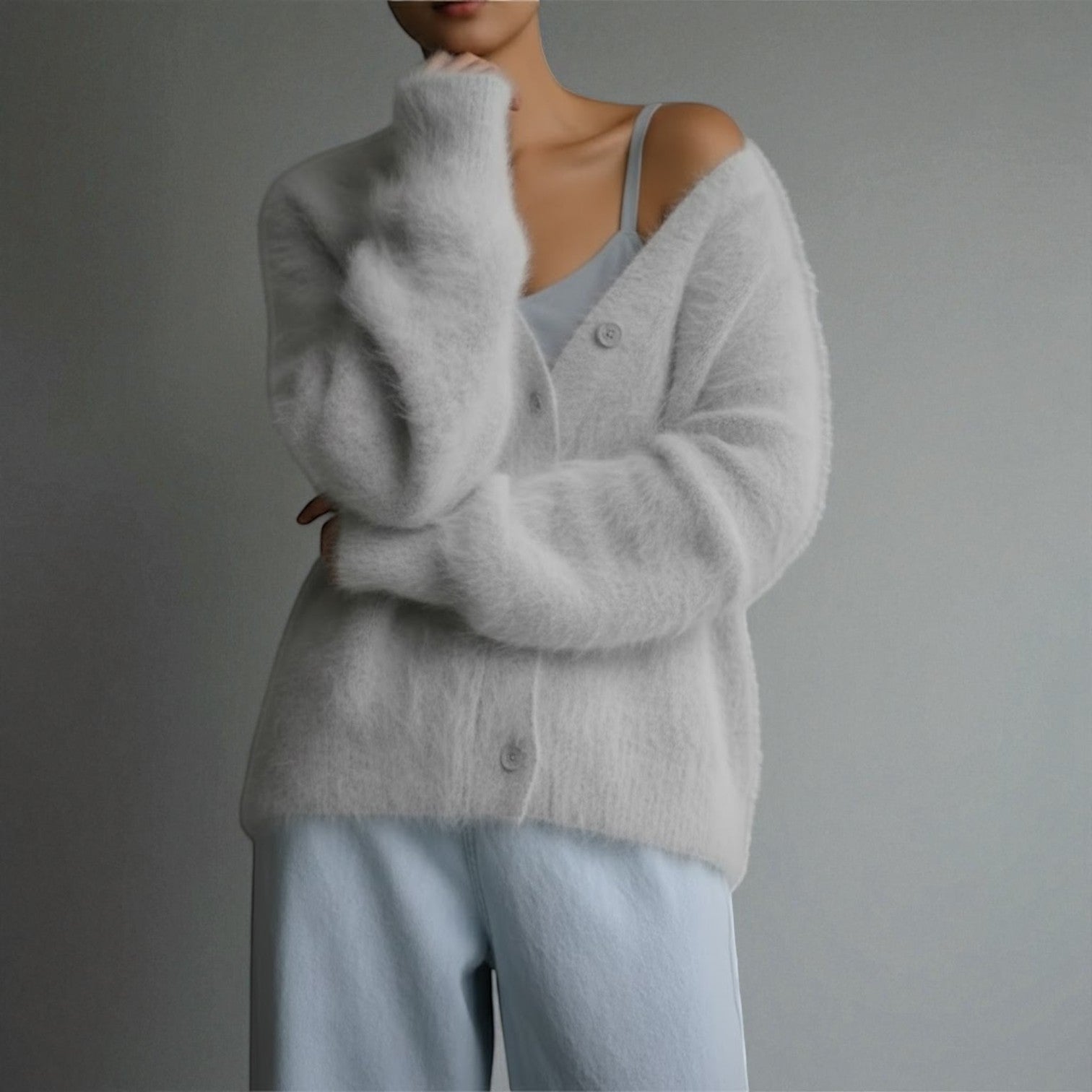 Women's loose-fit V-neck knit sweater in soft fabric, feminine silhouette for cozy winter warmth