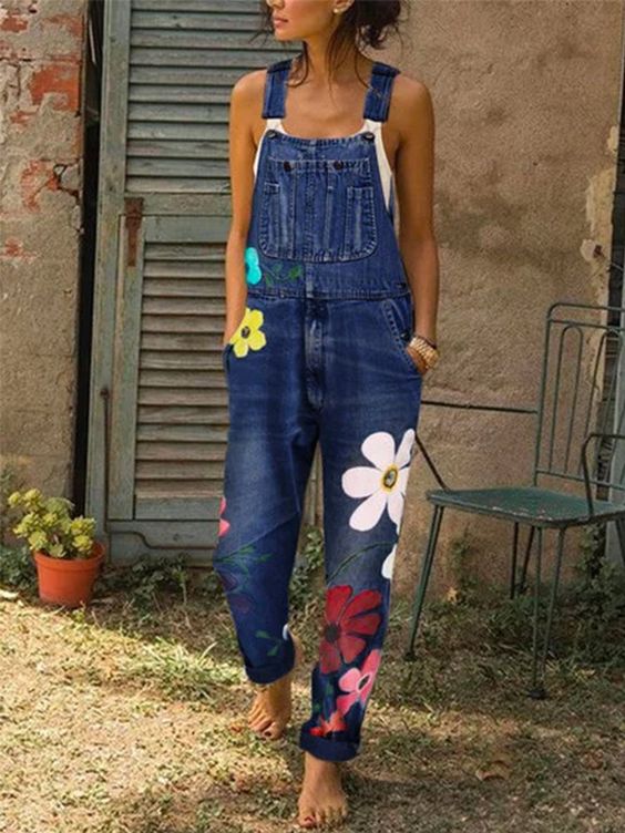 Women's sleeveless denim overalls with adjustable straps, front bib pocket, and rolled cuff casual fit