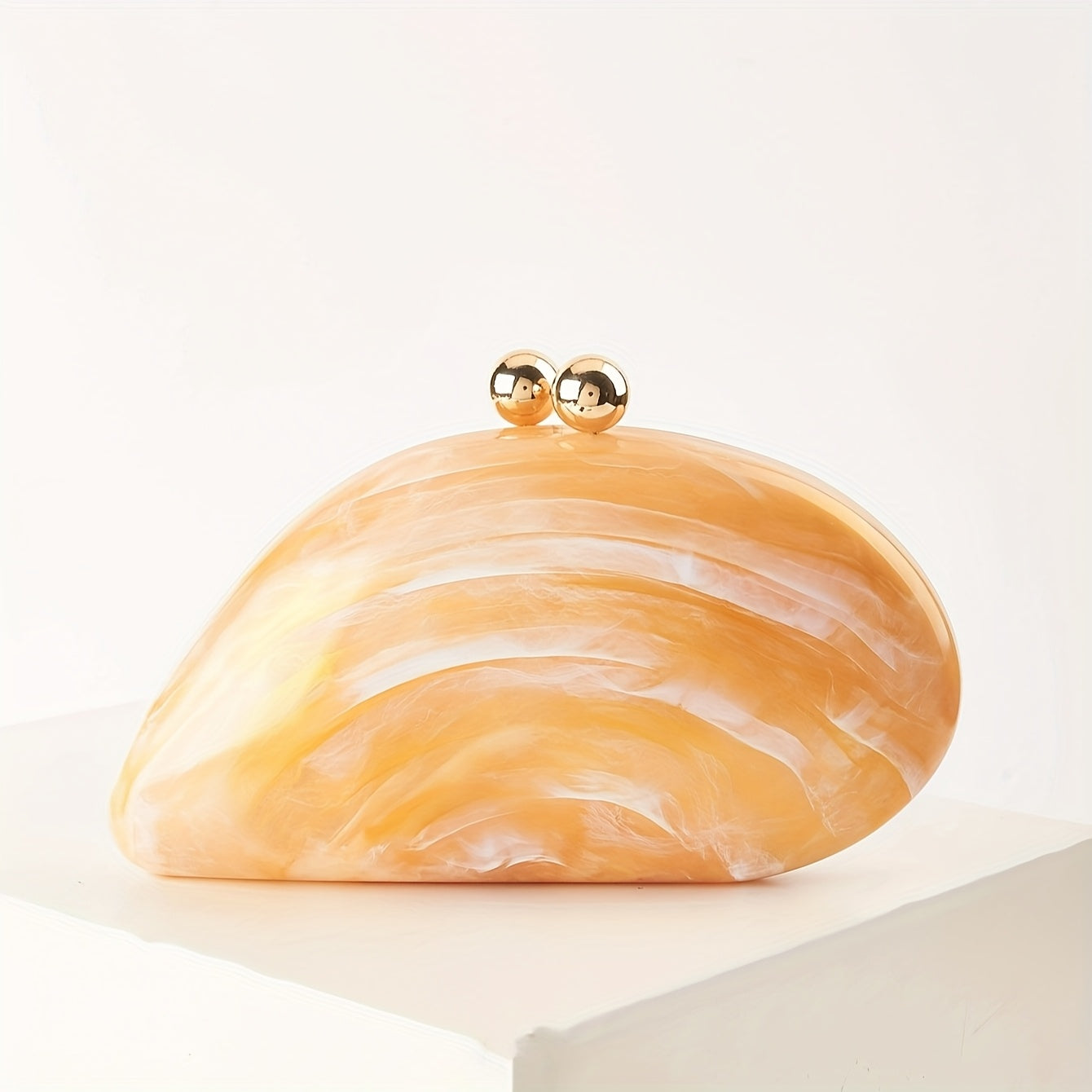 Marbled gloss acrylic clutch bag with gold kiss-lock clasp and detachable chain strap